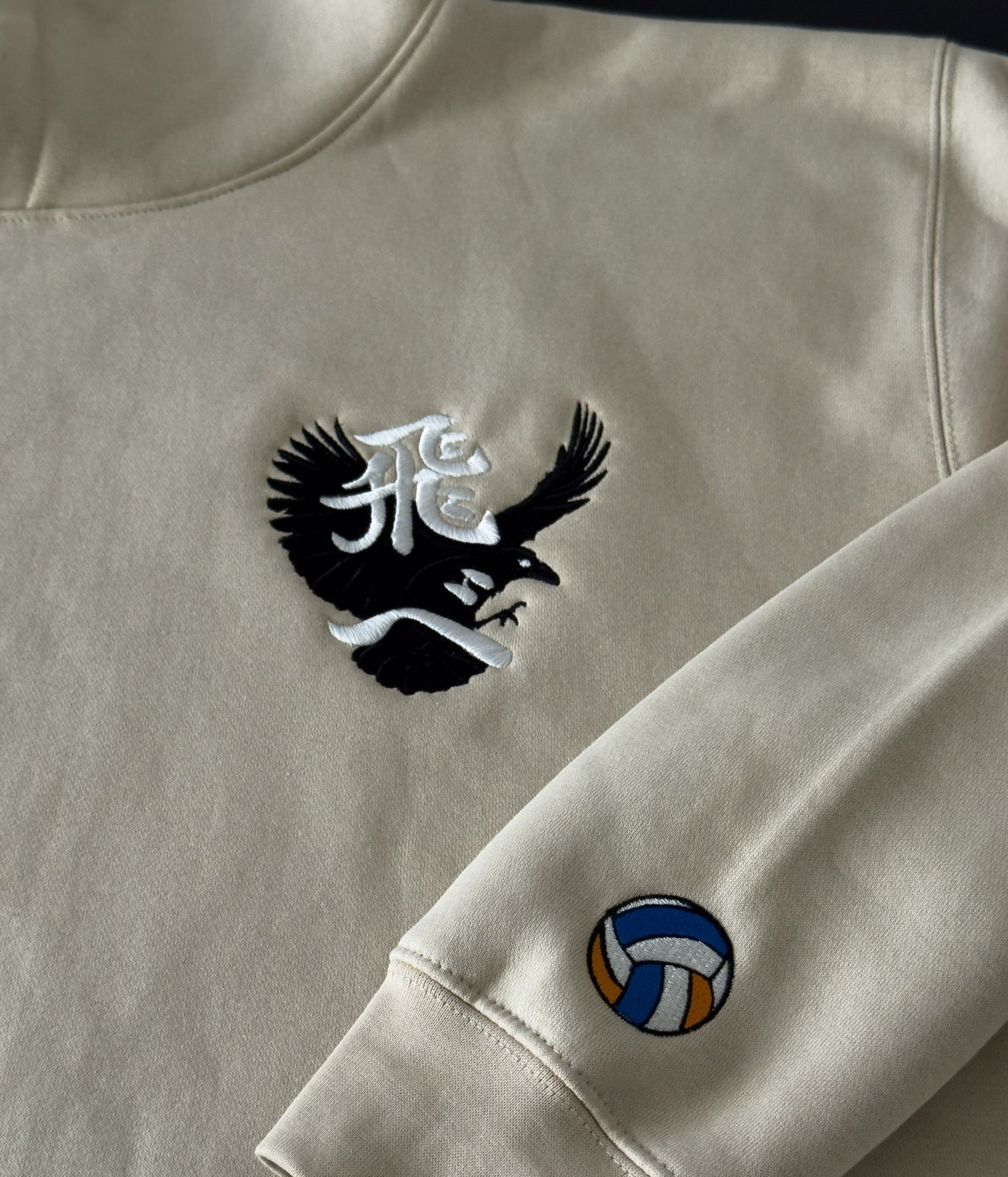 Bone hoodie with a ‘Tobe’ and crow on the chest and Volleyball on sleeve