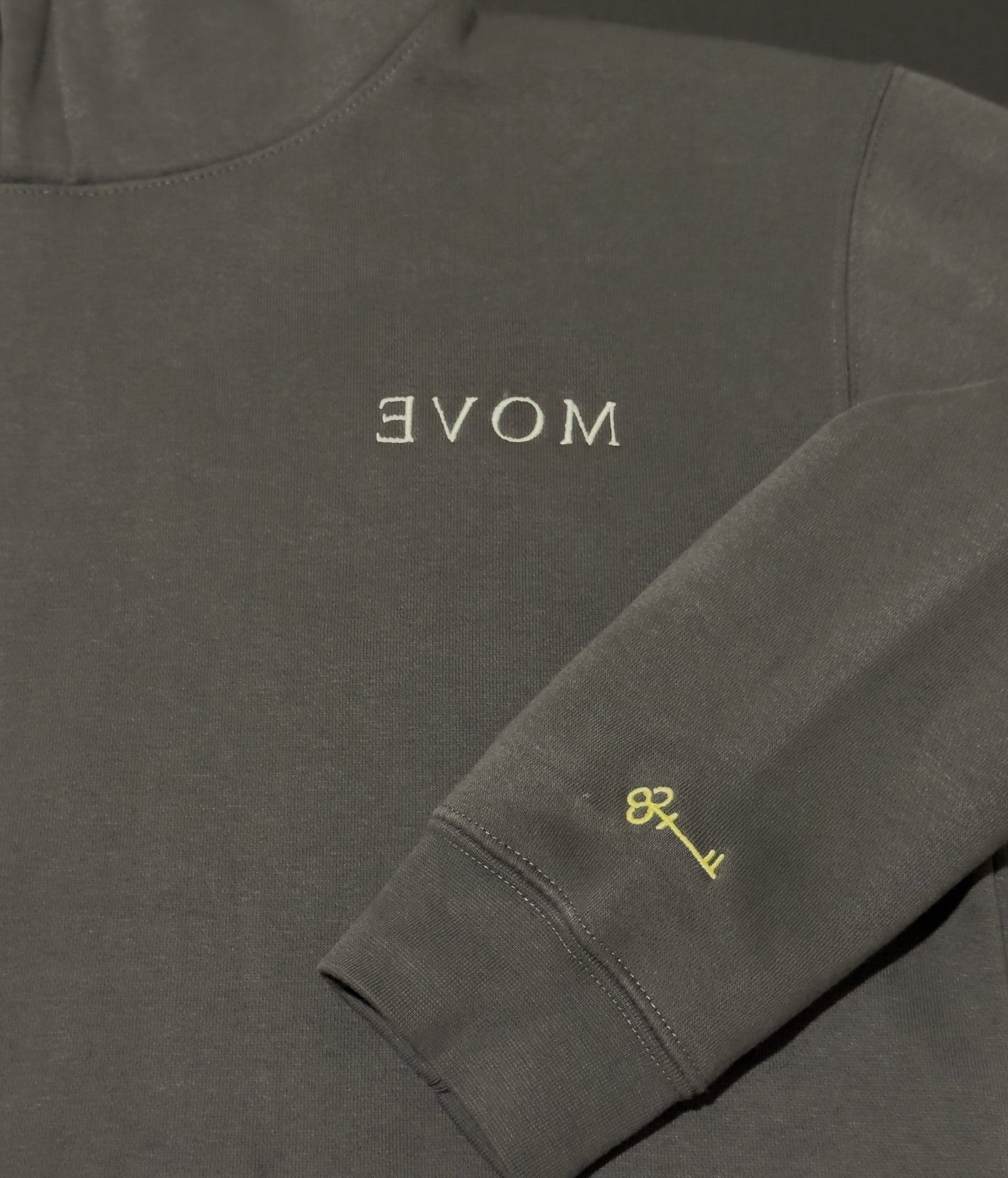 Shadow hoodie with 'MOVE' on chest and key on sleeve